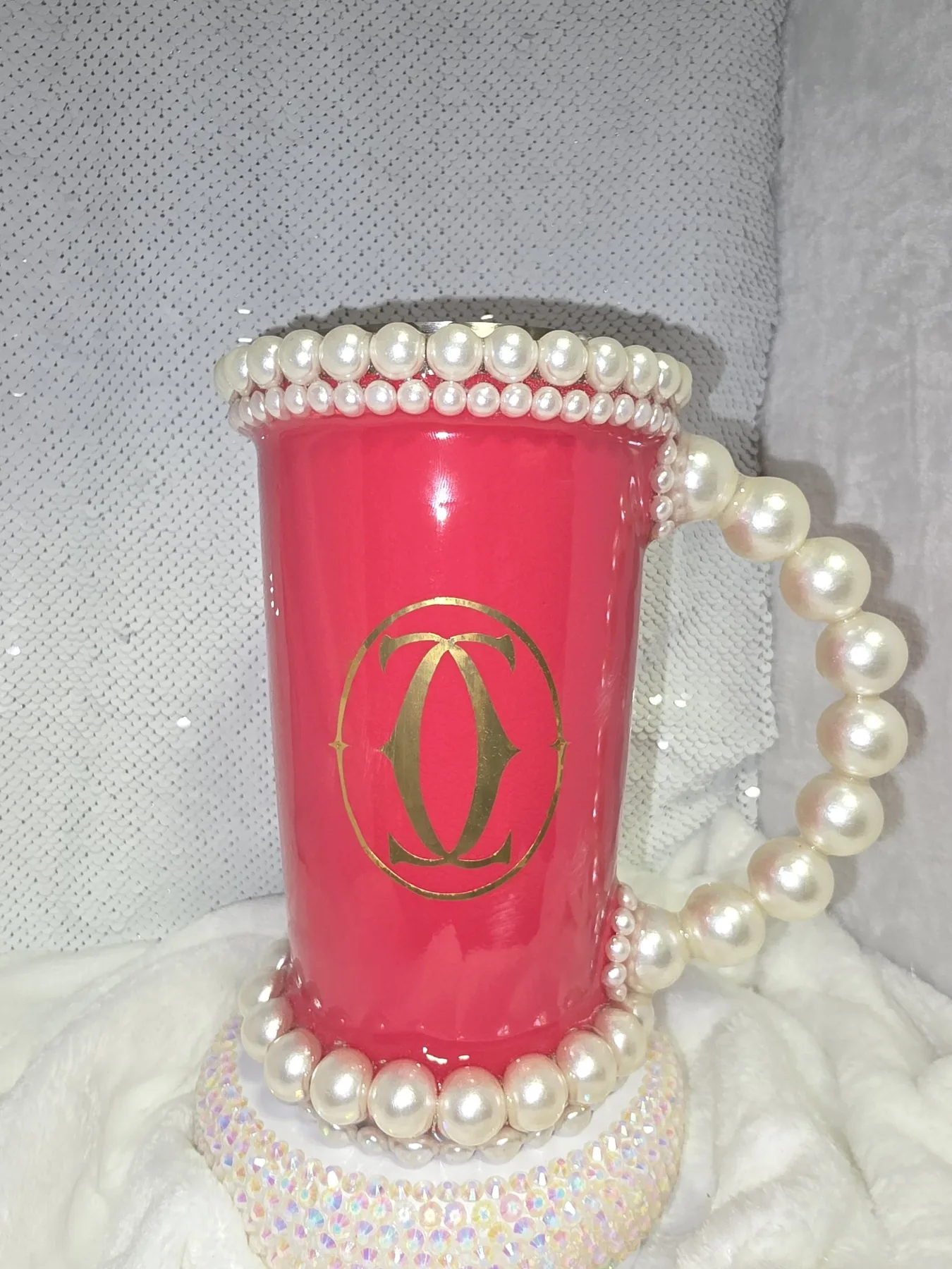 Angled view of pearl trimmed pink tumbler