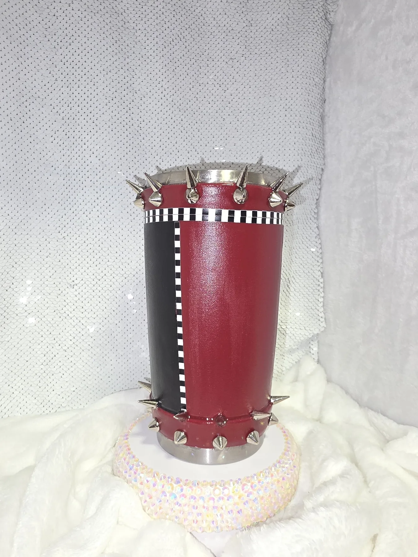 Burgundy, black, checkerboard and silver spiked tumbler in process before epoxy